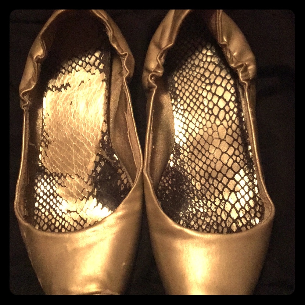Worn gold ballet flats
